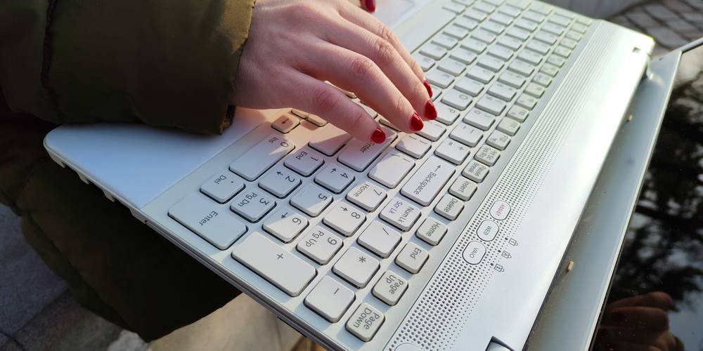  Michigan renter completing an online court form on a laptop 